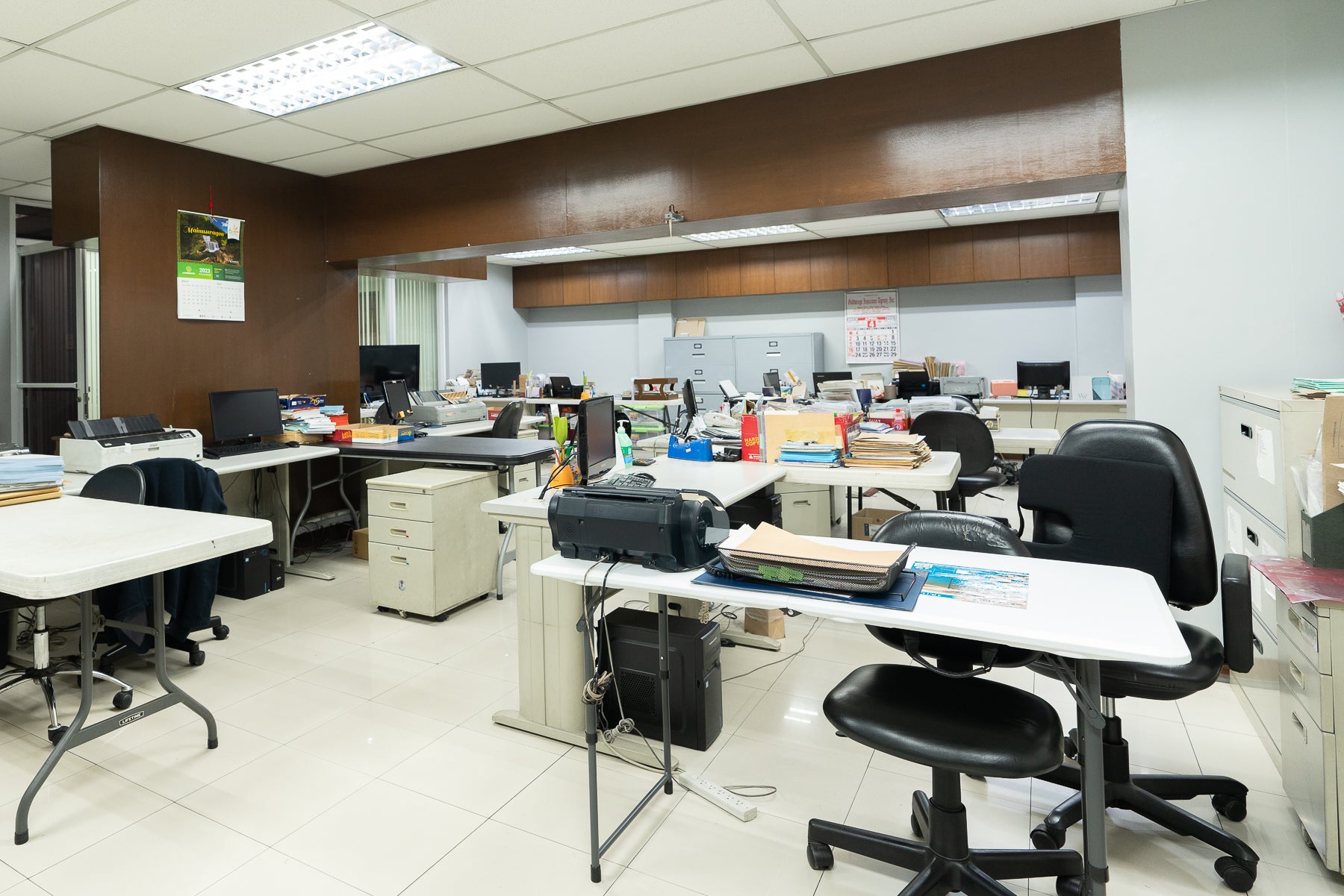 A clean workspace with a lot of office furniture